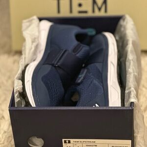 Blue and White Athletic Shoes 
Tiem Slipstream